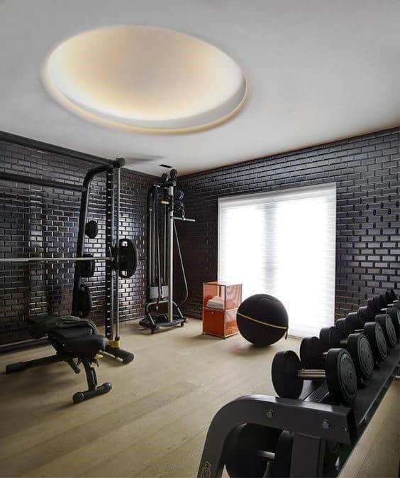 Black Brick Wall Home Gym With Hardwood Flooring Design Ideas