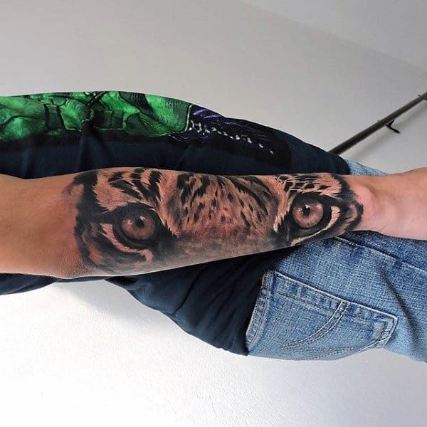 mens-forearms-cool-tiger-eyes-tattoo.jpg