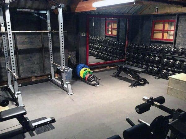 Rustic Man Cave Home Gym With Bench Press And Free Weights Rack
