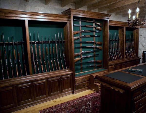 Wood Cabinets With Green Backing In Gun Room