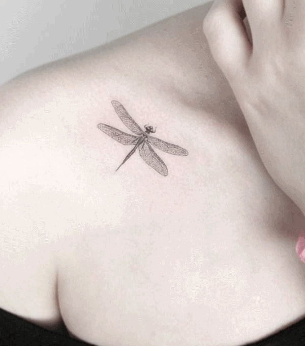 A single dragonfly in all its glory around the woman's shoulder making a perfect occassion to rock the off-shoulder top 