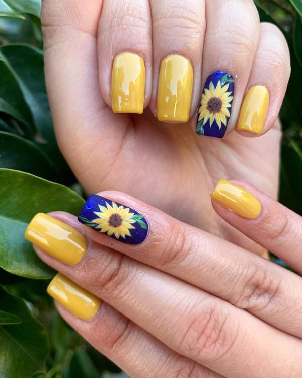 Yellow nails with sunflower designs