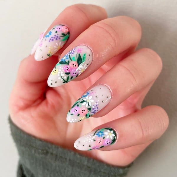 Intricate floral design on stiletto nails