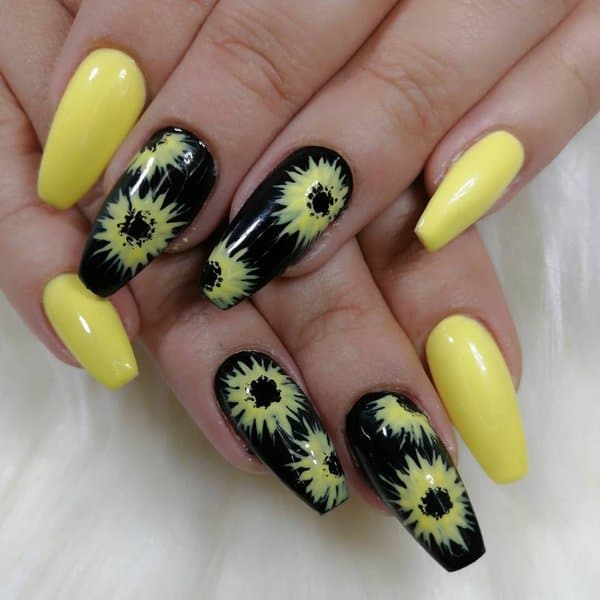 Yellow nails with black sunflowers