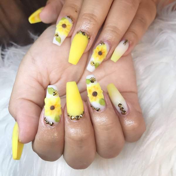Yellow nails with sunflowers and rhinestones