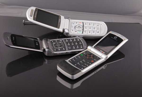 Old,Classic,Flip,Style,Cell,Phones,On,Black