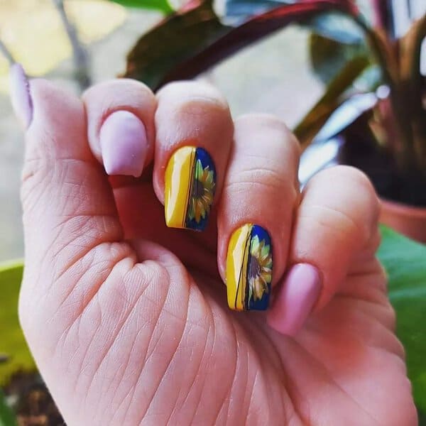 Blue and yellow nails with sunflowers
