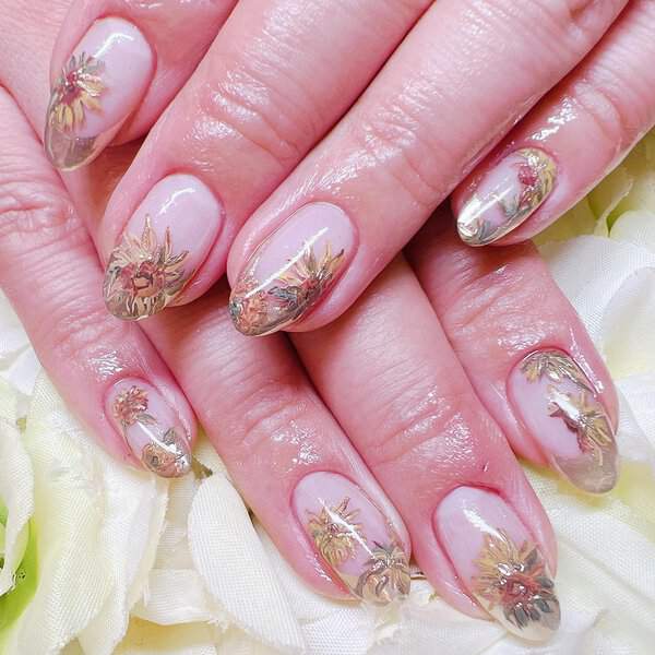 Nude nails with gold sunflower designs