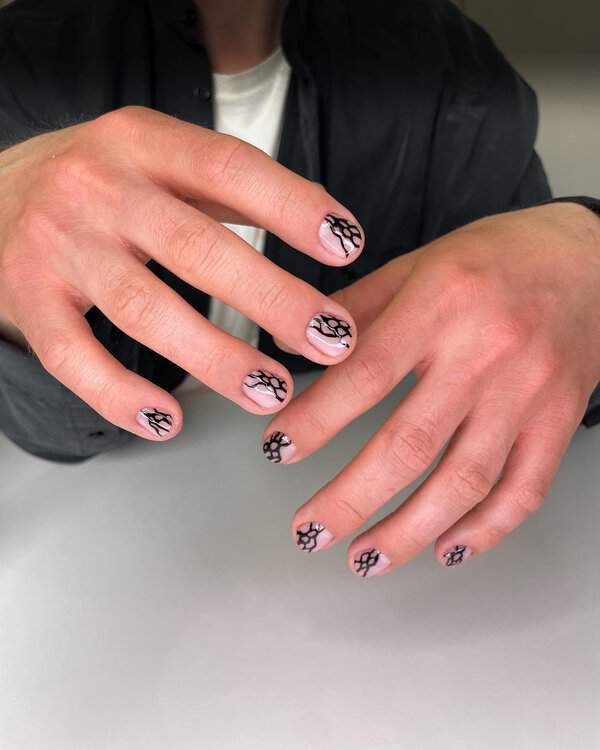 Black net design on nude nails