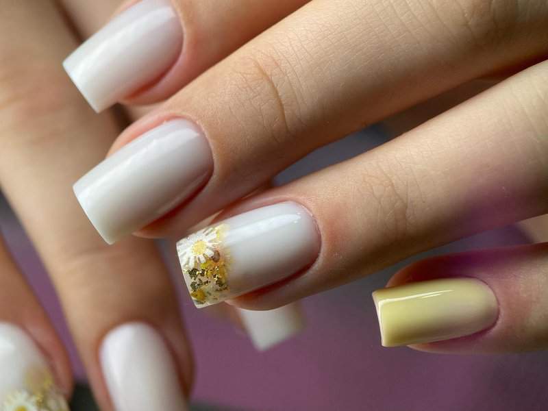 White nails with flower details