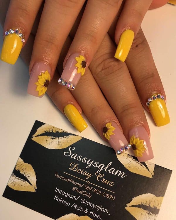 Yellow nails with sunflowers and rhinestones