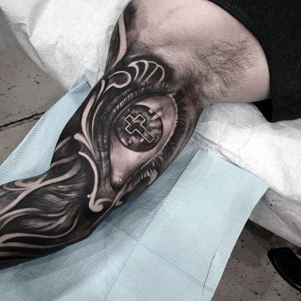 3d-eye-with-cross-mens-badass-inner-arm-sleeve-tattoo-ideas