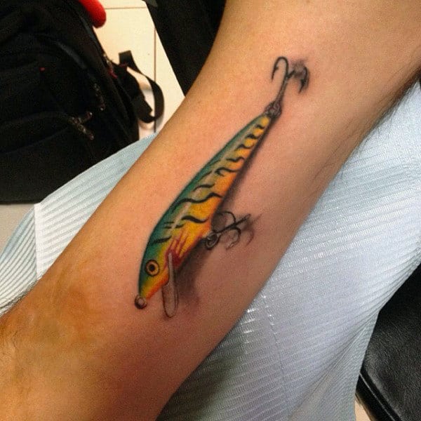 3d Fishing Inspired Hook Tattoo On Mans Forearm