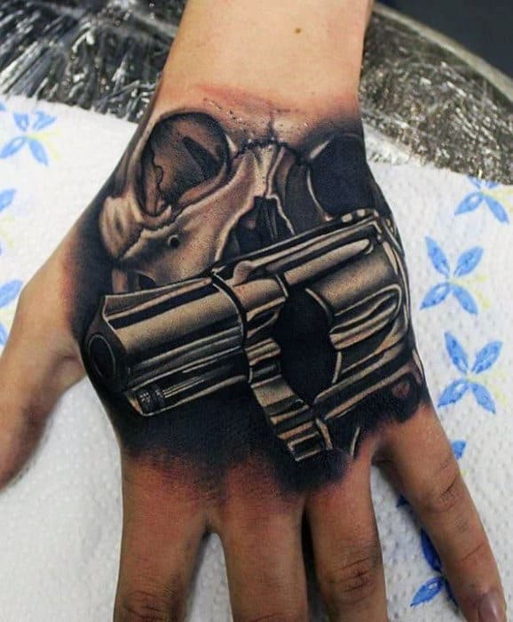 3d Mens Skull And Revolver Tattoo Design On Hand