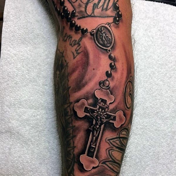 3d Realistic Forearm Cross With A Rosary Tattoo For Guys