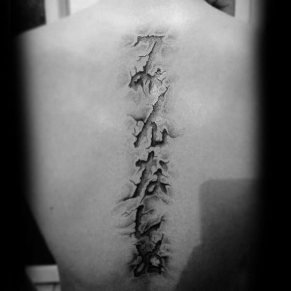 3d Torn Skin Spine Lettering Tattoos For Guys