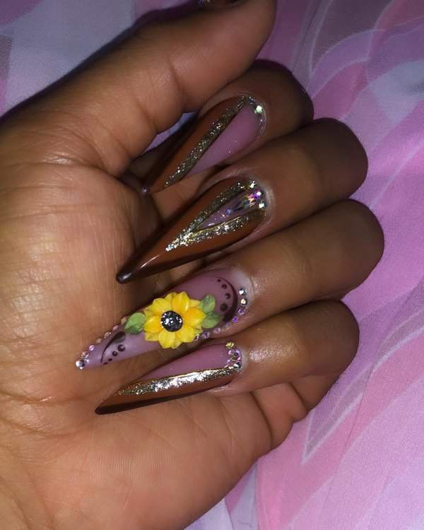 brown and purple stiletto nails with sunflower design