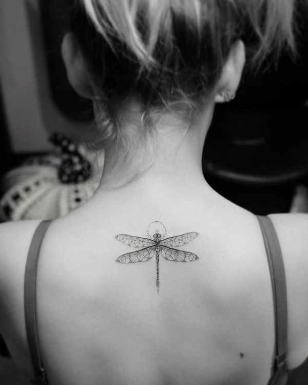 The specially crafted dragonfly just below the hairline making a perfect occassion to wear a backless 