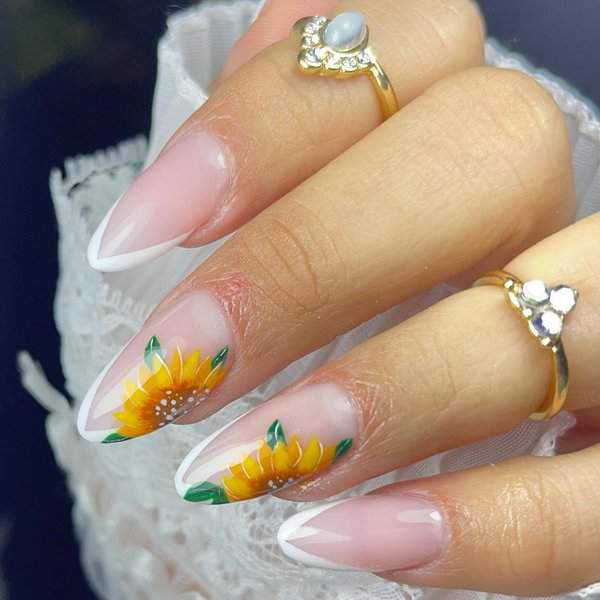  French tip nails with sunflower design