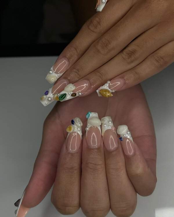 Nude nails with shells and gems