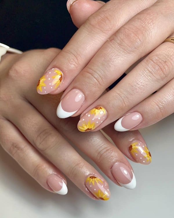 French manicure with sunflower accents