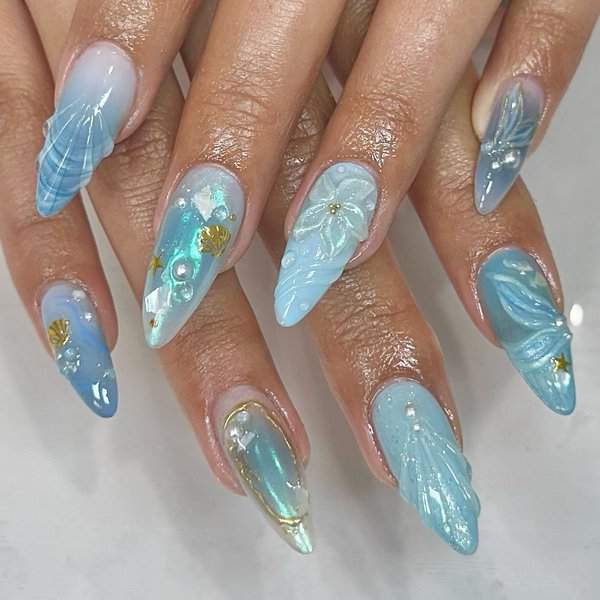 Blue nails with 3D mermaid designs