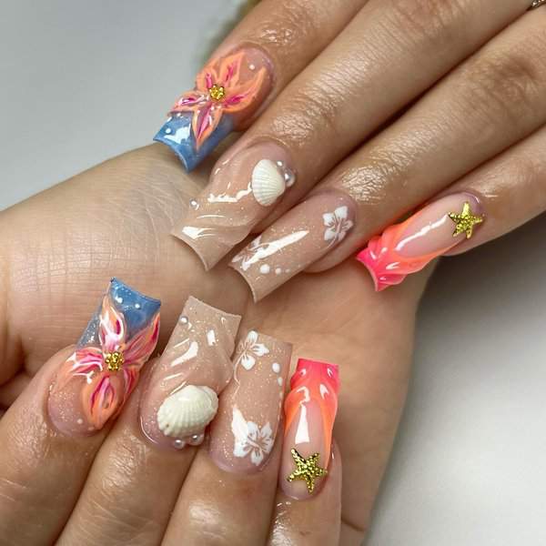 Beach-themed nails with shells and starfish