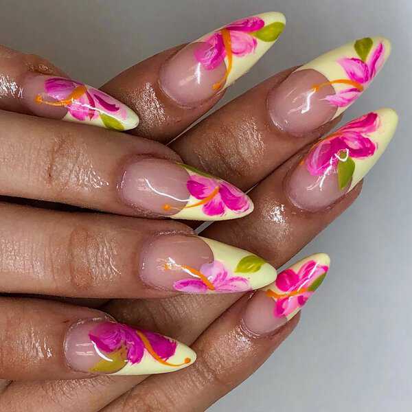 Yellow stiletto nails with pink flowers