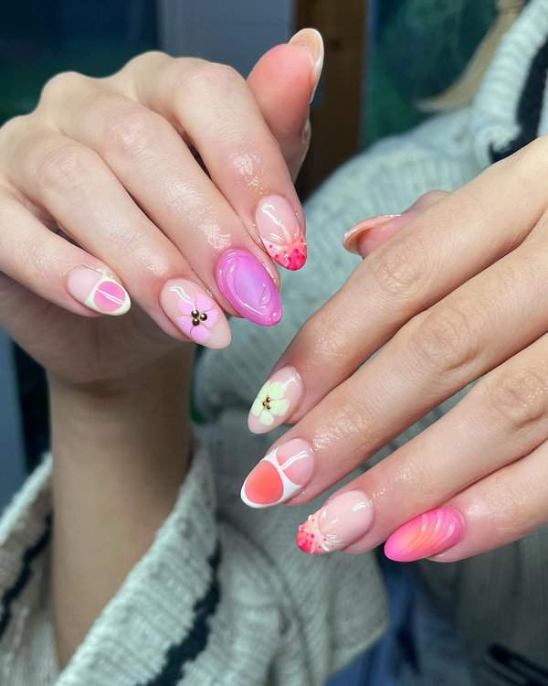 Multicolored nails with flowers and swirls