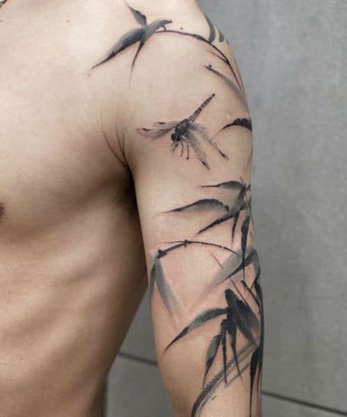 A cluster of dragonflies inked over the man's body making a perfect summer accessory 