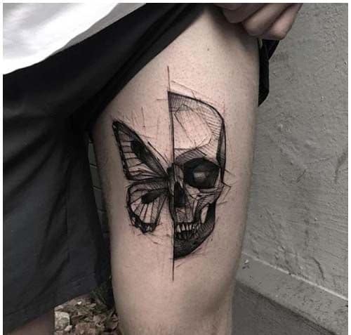 large black and grey tattoo on man's thigh of half of a surrealistic butterfly and half a skull face