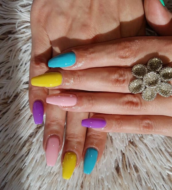 Colorful pastel nails with floral ring
