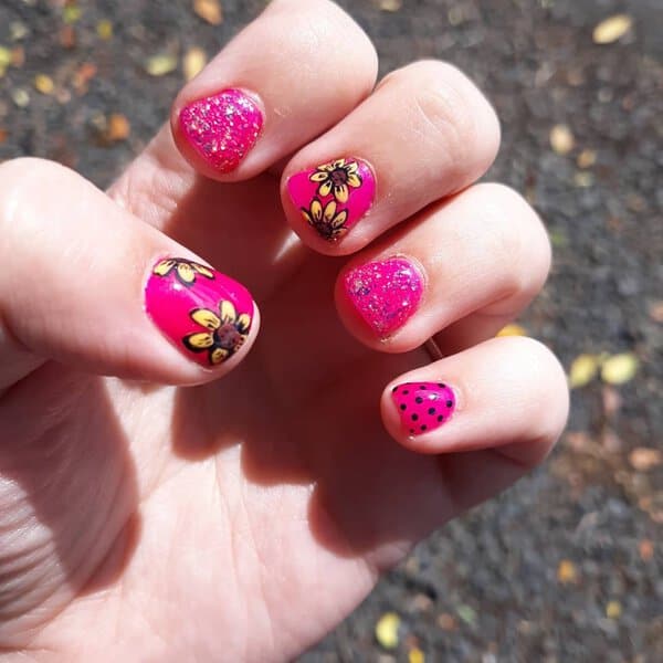 Pink glitter nails with sunflowers
