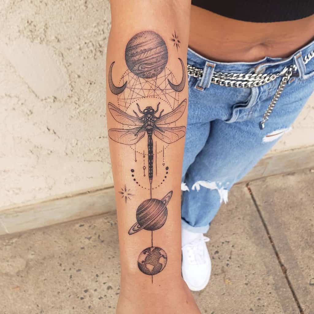 A dragonfly accentuated with the stars and planets making you live on the earth's edge 