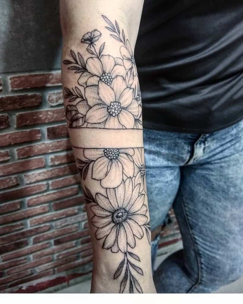 large black and grey geometric half-sleeve tattoo on forearm of a sunflower and peonies with negative middle strip space
