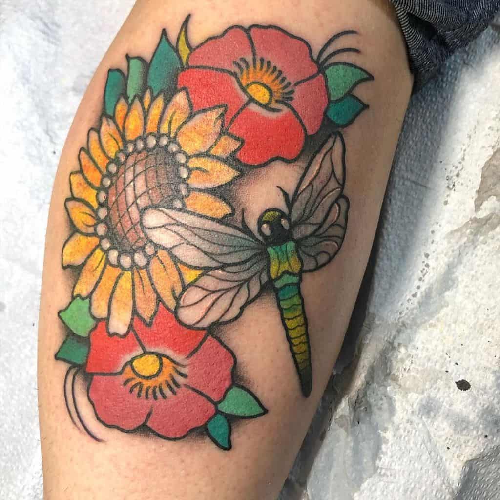 The apt fusion of flowers and dragonfly on the body signalling the confrontation of life's hassle and arising above them 
