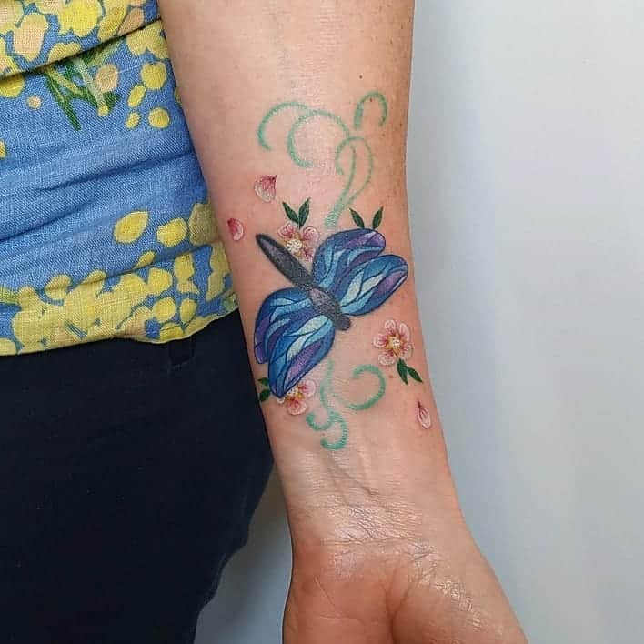 The cobalt dragonfly flying around the flowers depicting the new life 