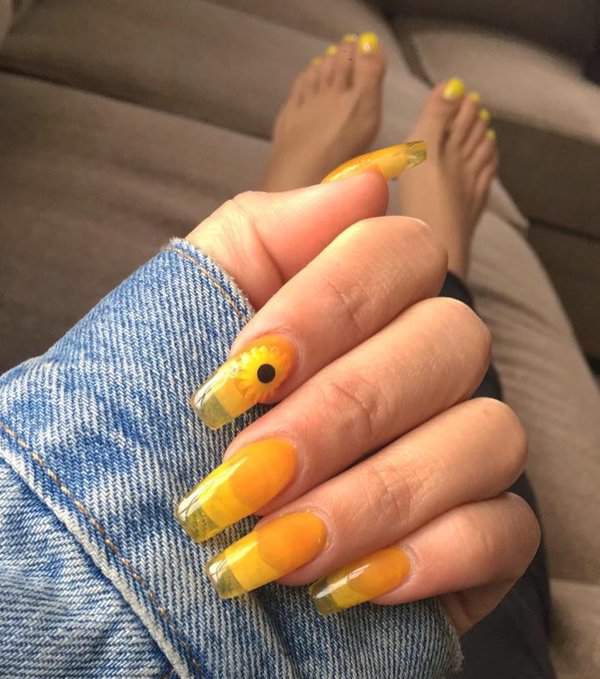 Clear nails with yellow sunflower tips