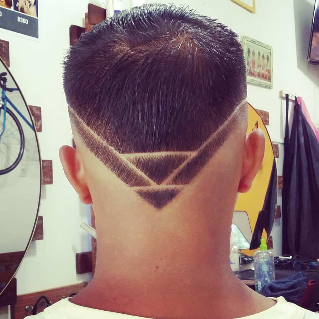 A Hi Top Fade Haircut Featuring Long Hair On Top And A Perfectly Designed V Cut At The Back