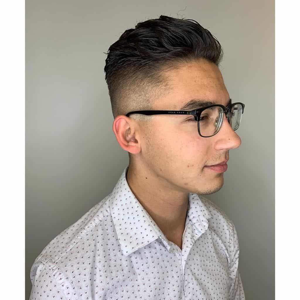 A High Top Style Featuring Swept Back Top Paired With Faded Sides And Back