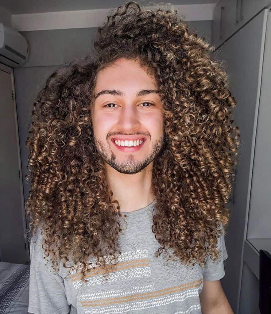 A Medium Length Jewfro Style With Highlighted Tips