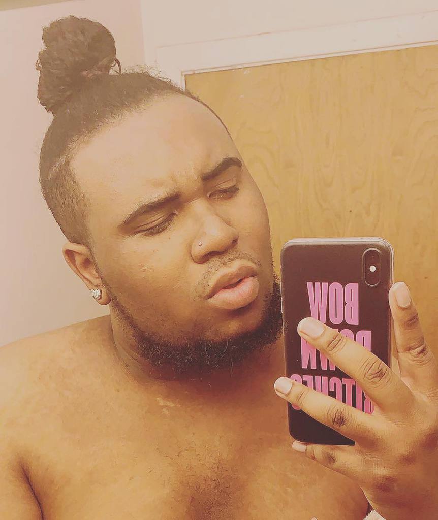 A Textured Man Bun Hairstyle For African American Guys