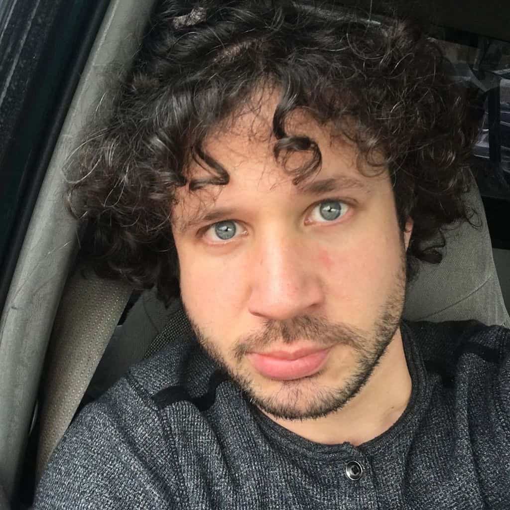 A Well Defined Jewfro Cut With Bangs