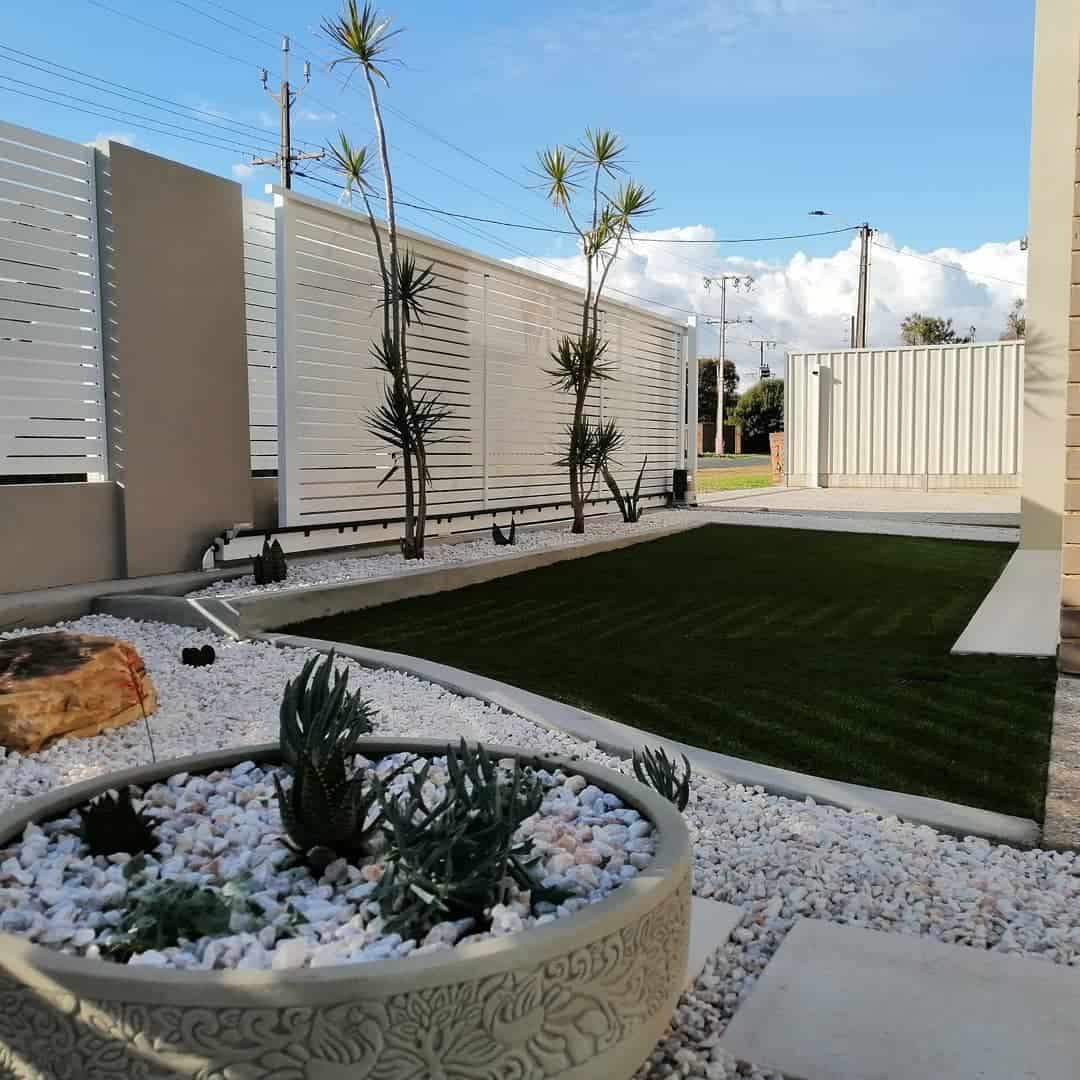 artificial turf grass backyard white fence 