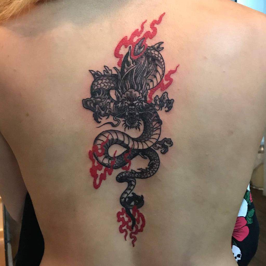 one big exquisite chinese dragon tattoo on her back