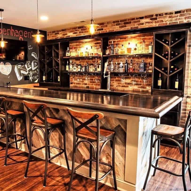 basement wet bar exposed brick wall beer on tap