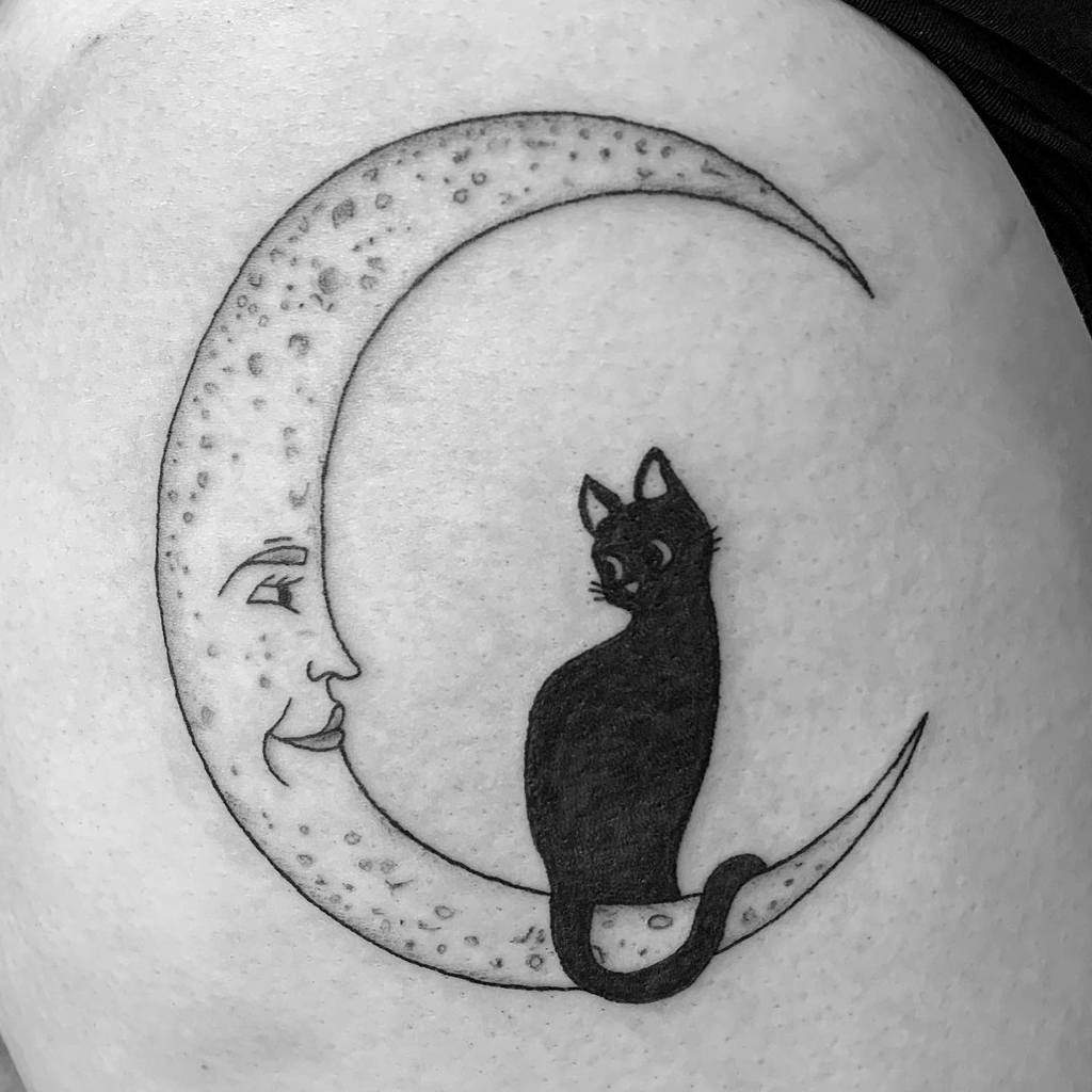 Hey guys So I recently got this tattoo of a black cat and a moon bc Ive  always been intrigued by them and as soon as I walked out of the tattoo