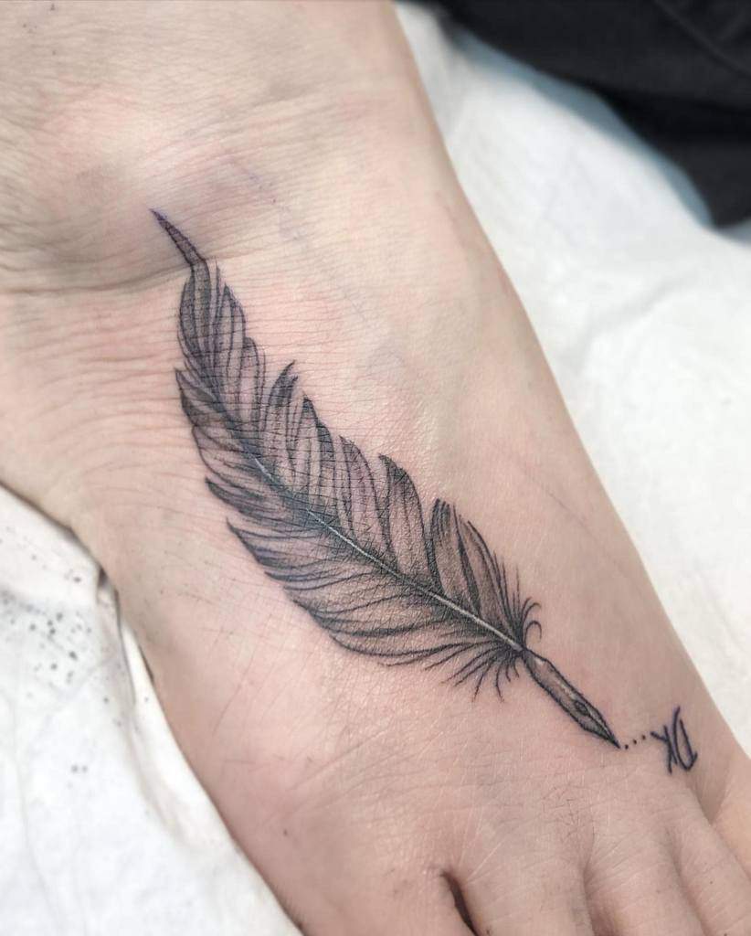 Black and Gray feather foot tattoo