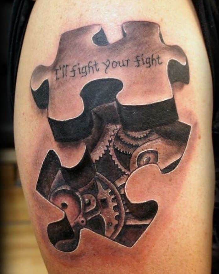 Black and gray upper-arm tattoo of puzzle piece removed to reveal clock working and an inspirational quote.