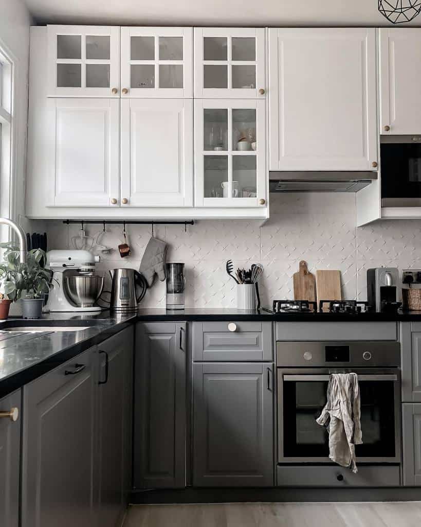 white and gray kitchen cabinets textured backsplash 